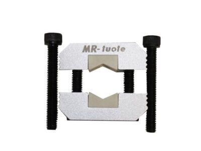 Iskunvaimentimen männän kiinnipidin